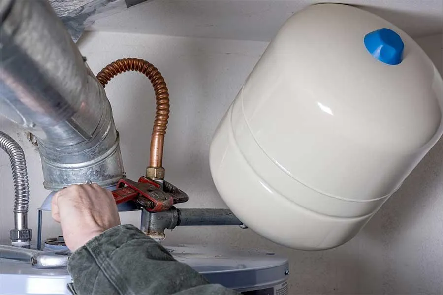 A Plumber fixing water heater